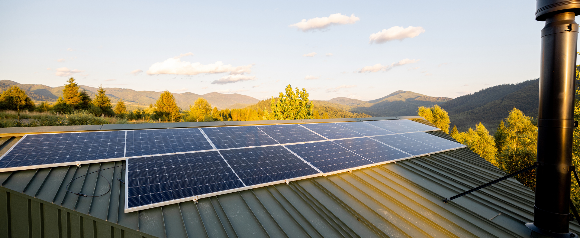 Homes with solar panels and rising sun background