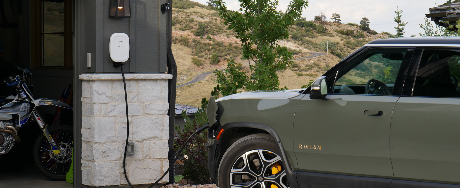 Emporia EV charger and electric vehicle in driveway