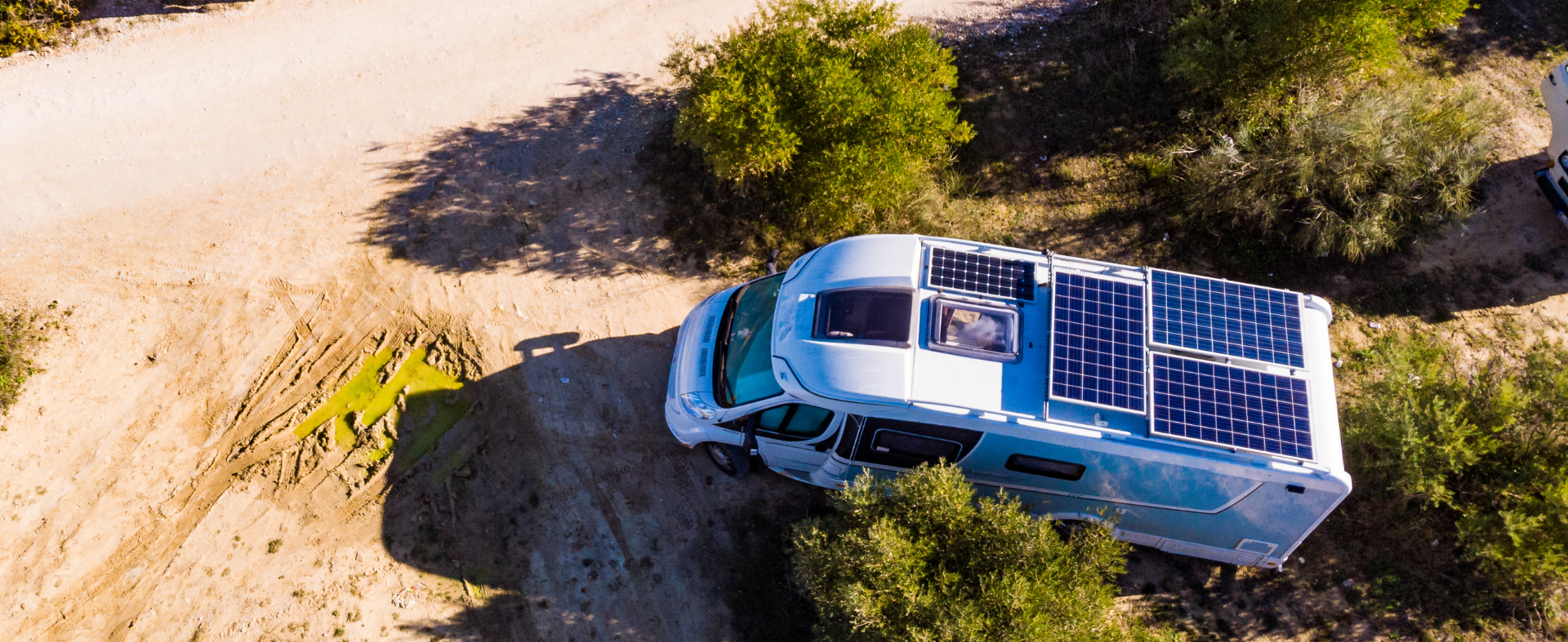 Van with solar panels on the roof in desert