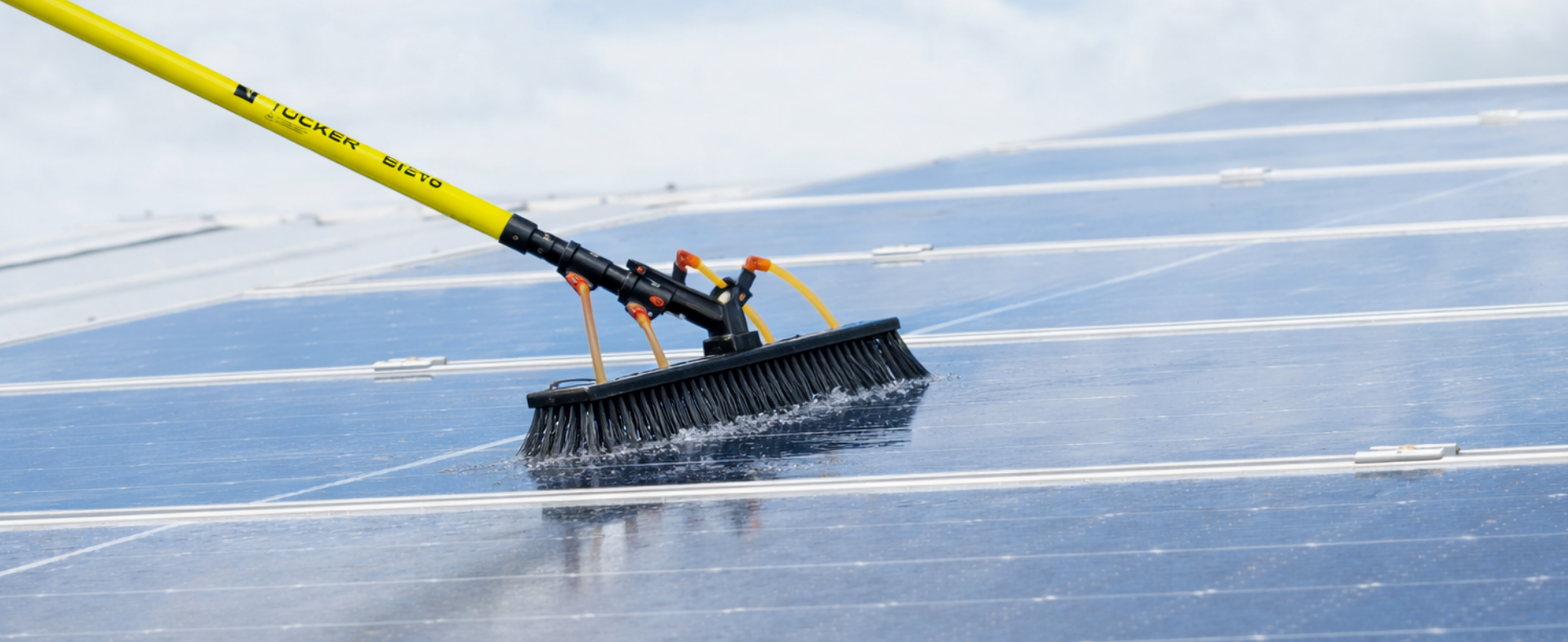 Tucker water fed pole cleaning system washing solar panels.